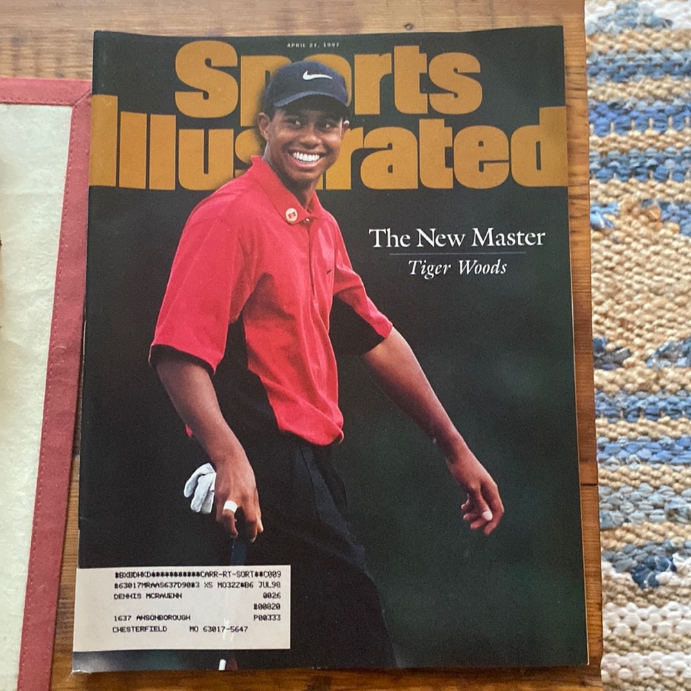 This is a tiger woods 1997 sports illustrated book never opened.